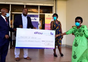 Dfcu Bank Contributes Shs70m Cash, Sanitation Items Worth Shs30m To  COVID-19 Fight