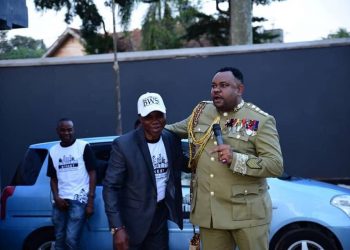 Lambert gives cars to Ugandans