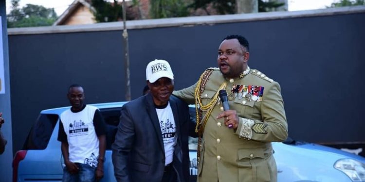 Lambert gives cars to Ugandans